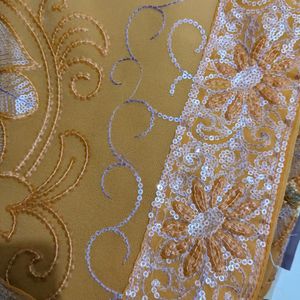 Cream And Orange Embroidery Saree