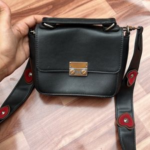 Black Sling Bag With Heart Strip