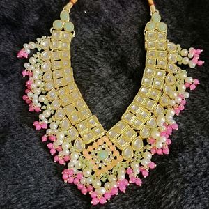 New Zaveri Pearls Green And Pink Stones Kundan Ne
