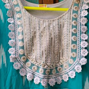 A Beautiful Kurti With White Embroidery Work