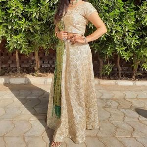 Cream Colour Lehenga Choli With Green Dupatta