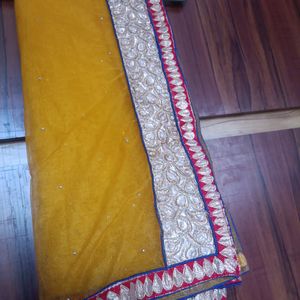 Peach and yellow netted hals saree.