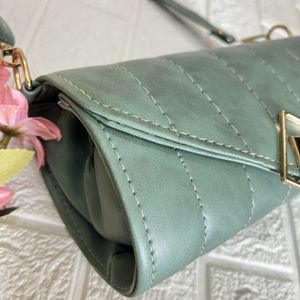 Green Roll shaped sling bag