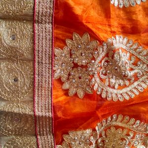 Selling Lehnga With Orange And Golden Colour