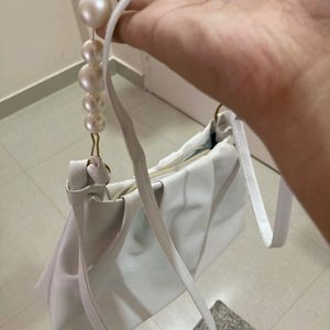 White pearl handbag