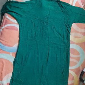 Dark green cotton kurta ...three quarters sleeves...beautiful neck line...no flaws..