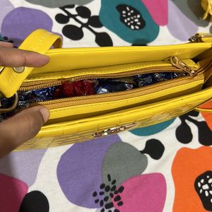 Yellow Sling bag.