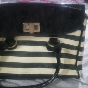 white and black strip handbag