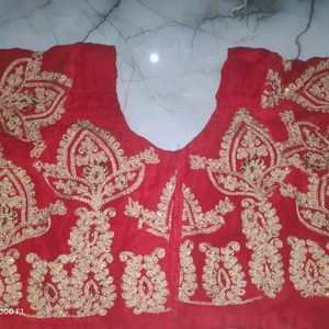 red blouse with golden stone work.