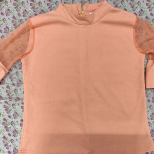 A Peach Trendy Top With Frills Sleeves