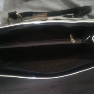 white and black strip handbag