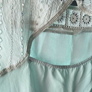 Mint green T-shirt with embroidery details