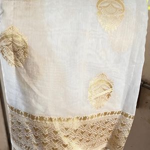 Beautiful saree with white and golden border.