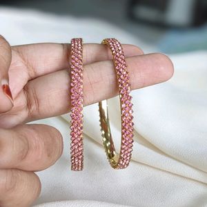 A Rose Gold Bangle With Ros Stones