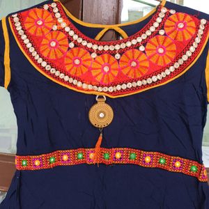 Flared Women Kurti With Rajasthani Work .