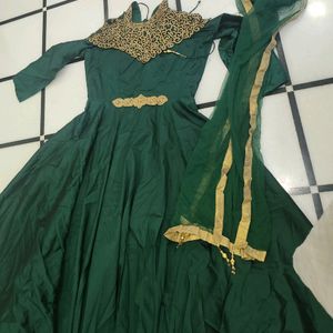 Luxurious Silk Dark Green Gown With Golden Stone