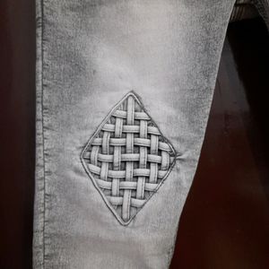 women grey mid rise jeans with beautiful check det