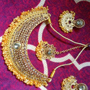 Golden Colour Neckpiece With Earrings And Bindi