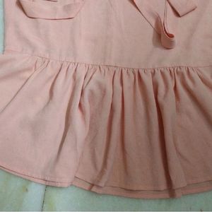 PEACH TIE UP AND PEPLUM TOP