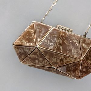 Golden brown diamond shape clucth