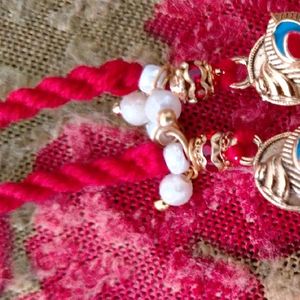 RAKHI With Red Beads, Pearls And Morpankh