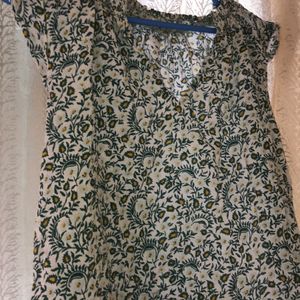 green printed Top with Leavy-flower Print on it.