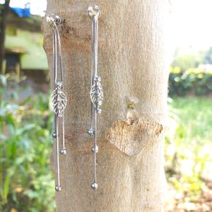 silver earrings with white stone .