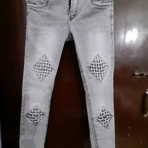 women grey mid rise jeans with beautiful check det