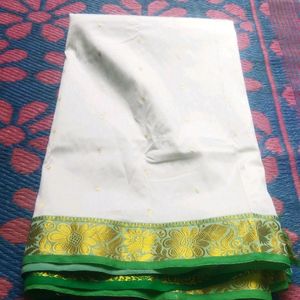 White Saree With Green And Golden Design