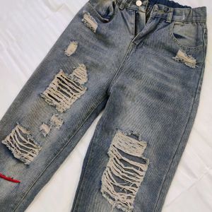 Women High-Rise Heavily Washed Distressed Jean