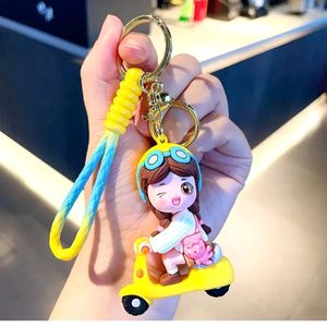 YELLOW SCOOTY GIRL KEYCHAIN