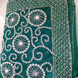 bottle green net saree with blouse and lehnga