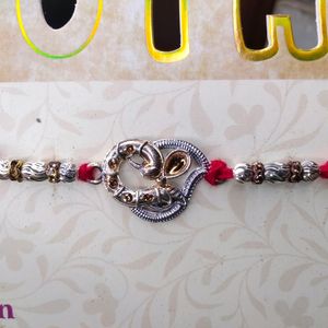 Peacock Design Raw Silver Rakhi For Brother