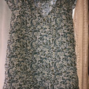 green printed Top with Leavy-flower Print on it.