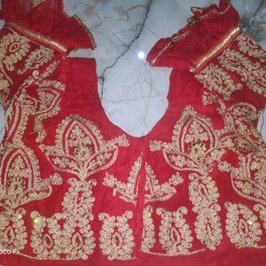 red blouse with golden stone work.