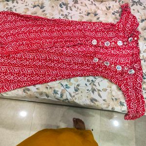 white anarkali with red shrug