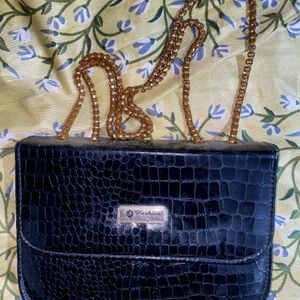 A Black Slingbag For Women