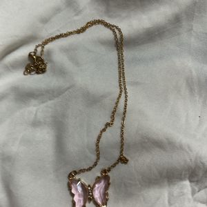 Pink Butterfly Pendant Along With Chain Attached