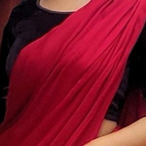 HOT RED SATIN SAREE WITH BLACK VELVET BLOUSE .