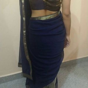 Blue Saree With Gold Borders .