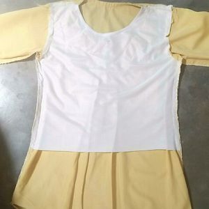 A Light Faded Yellow Pretty Top