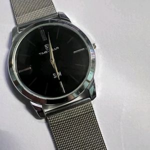 slim metallic watch