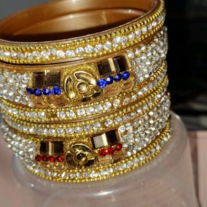 Multi-colored White Gold Stoned Bangles Set Of 8