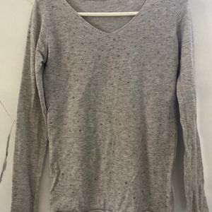 grey top with silver studs