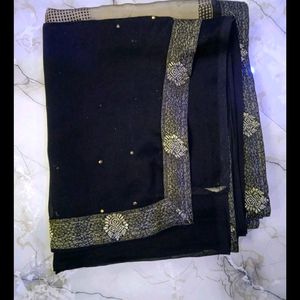 pretty olive black saree.