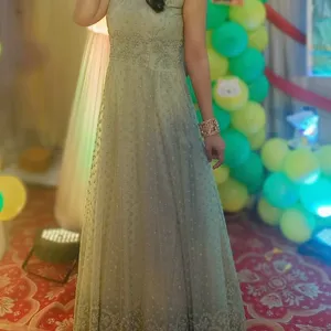 Pestal green gown with dupatta.