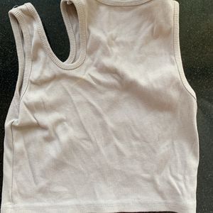 Cute Top With A Cut Out . 30-33 Bust