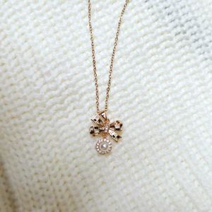 Beautiful Bow Pendant With Dangling Pearl Necklace