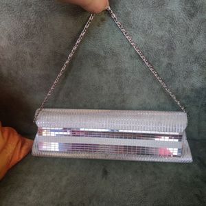 Silver Clutch. There are very few stains over it i