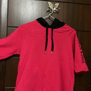 A Hooded Medium Length Half Sleeves Top